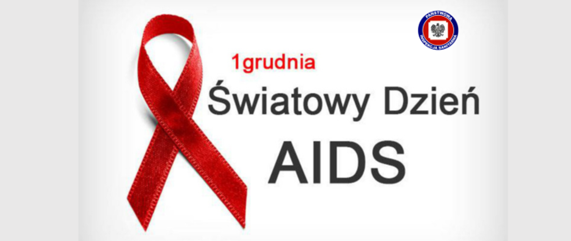 Na szarym tle z lewej strony widoczna jest czerwona wstążeczka, na środku widoczny napis - "1 grudnia - Światowy Dzień AIDS", w prawym górnym rogu widoczne logo Państwowej Inspekcji Sanitarnej.
