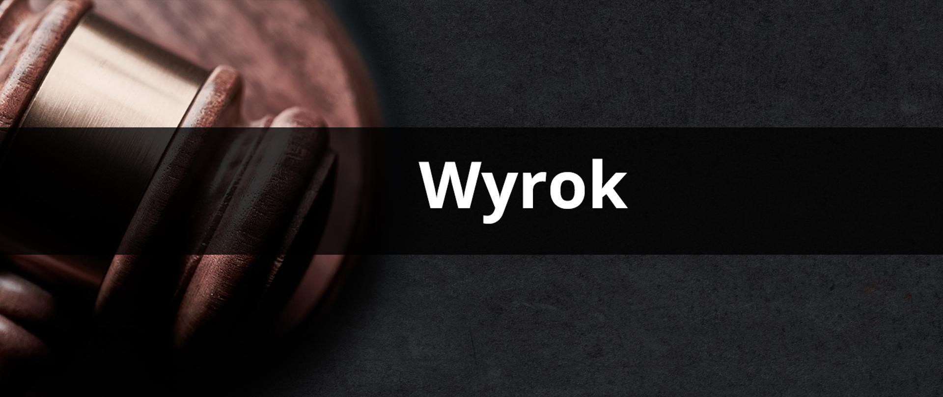 Baner wyrok. W tle młotek