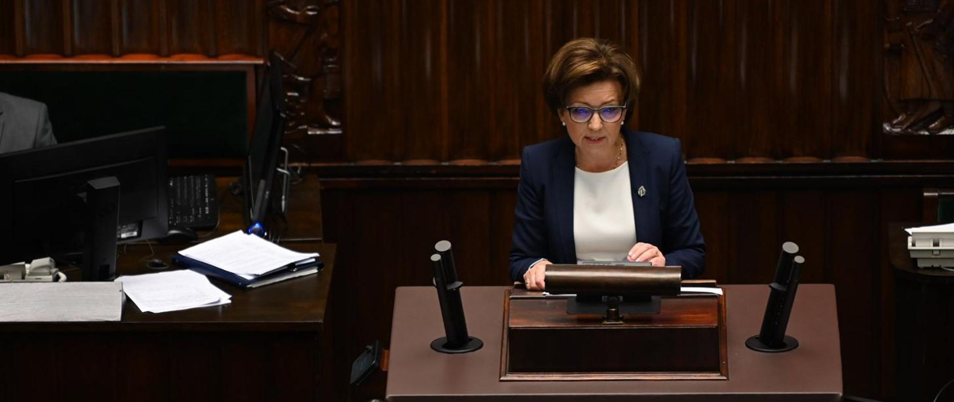 Minister of Family and Social Policy, Marlena Maląg, during her speech in the Sejm.