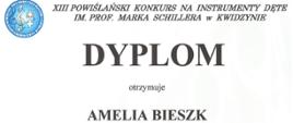 Na białym tle widnieje napis z nazwą i miejscem konkursu - XIII Powiślański Konkurs na Instrumenty Dęte im. Prof. Marka Schillera w Kwidzynie, imieniem oraz nazwiskiem ucznia - Amelia Bieszk. Nazwa szkoły, którą reprezentuje uczeń, nazwisko pedagoga - Anita Luzak-Czechowska i miejsce, które otrzymał - II miejsce. Poniżej podpisy jurorów oraz pieczątka organizatora.