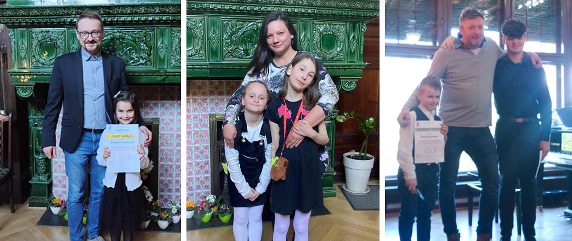 Uczniowie i nauczyciele z dyplomami, na tle starego kaflowego pieca