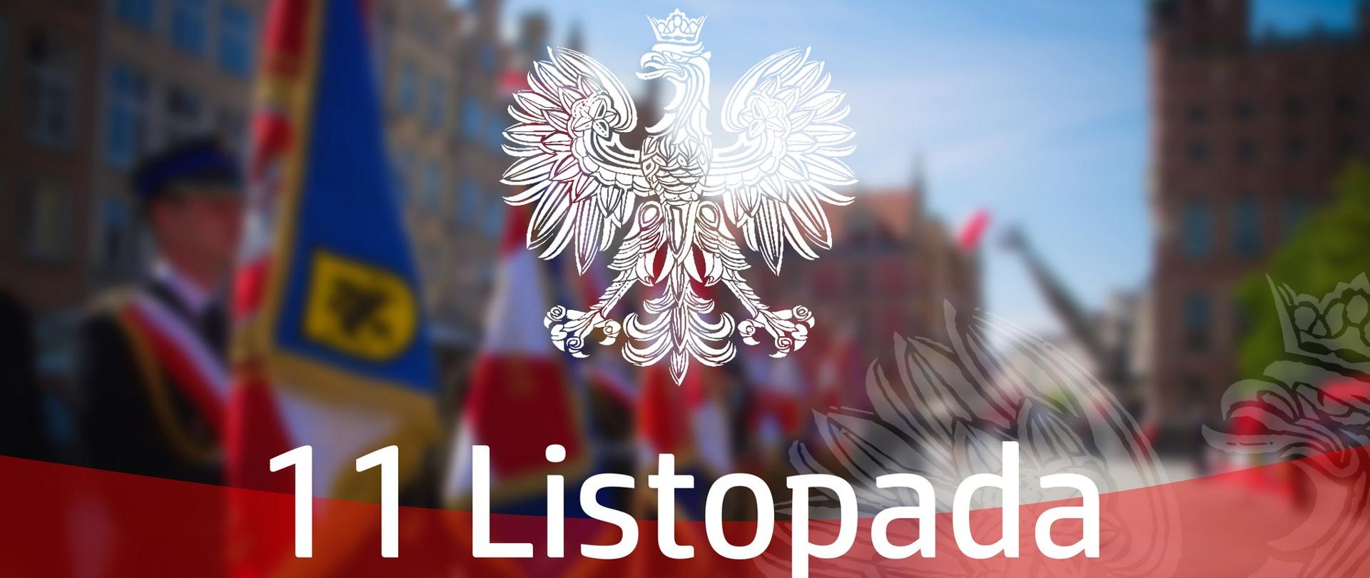 Zdjęcie przedstawia godło na rozmazanym tle z napisem święta