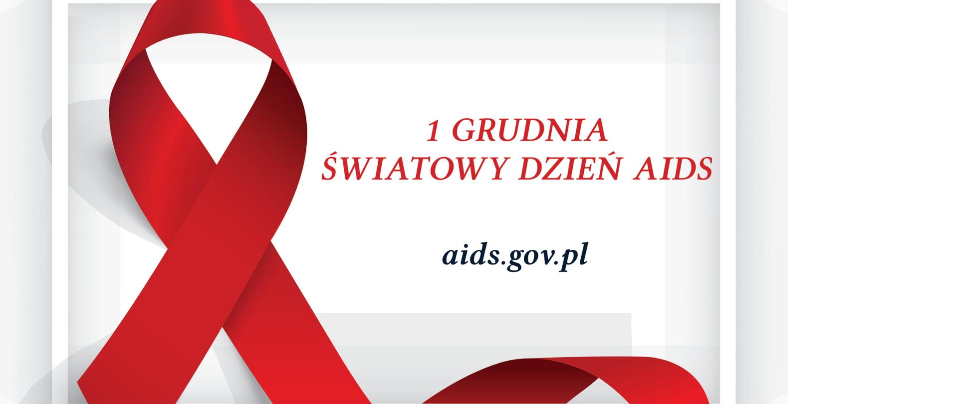 Ilustracja przedstawia prostokątną białą ramkę we wnętrzu, której znajduję się czerwona wstążka owijająca prawym jej ramieniem dolną część ramki. W prawej części wnętrza ramki widnieje napis ,,1 Grudnia Światowy Dzień AIDS” oraz adres internetowy strony aids.gov.pl