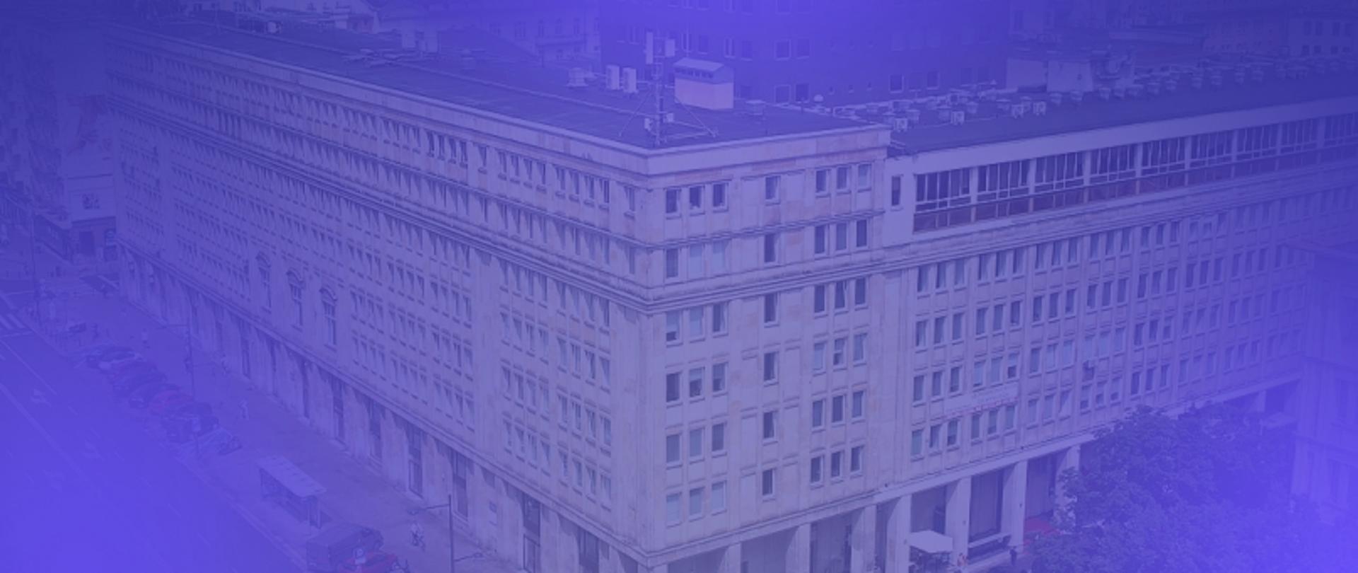 Na zdjęciu budynek GUNB w niebieskiej poświacie.