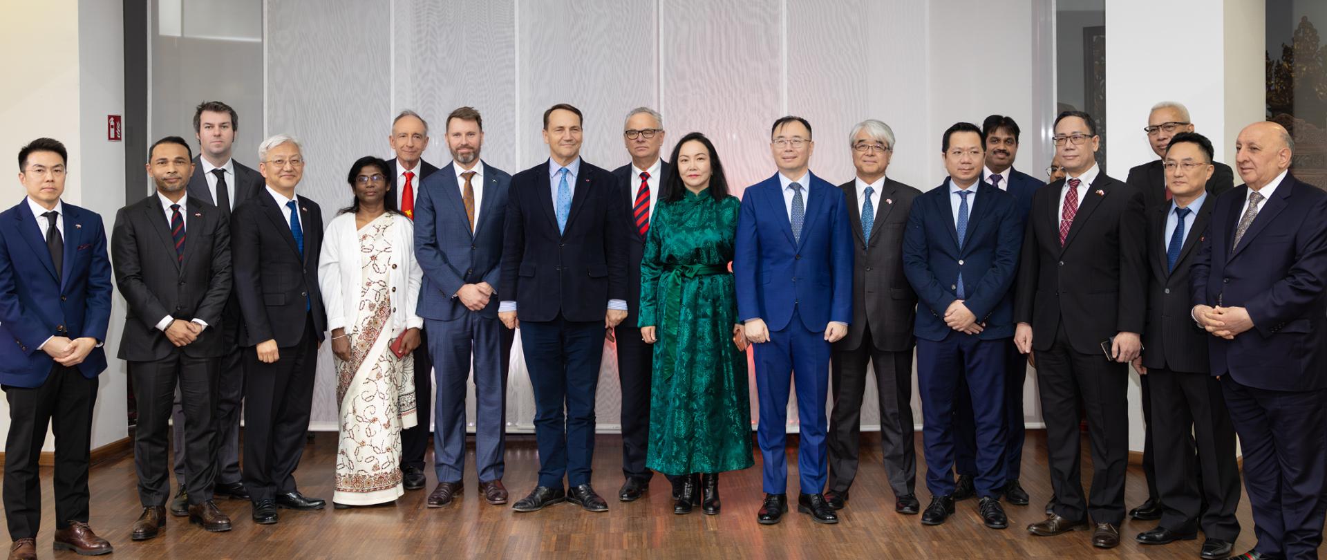 A group of people are standing in the photo
