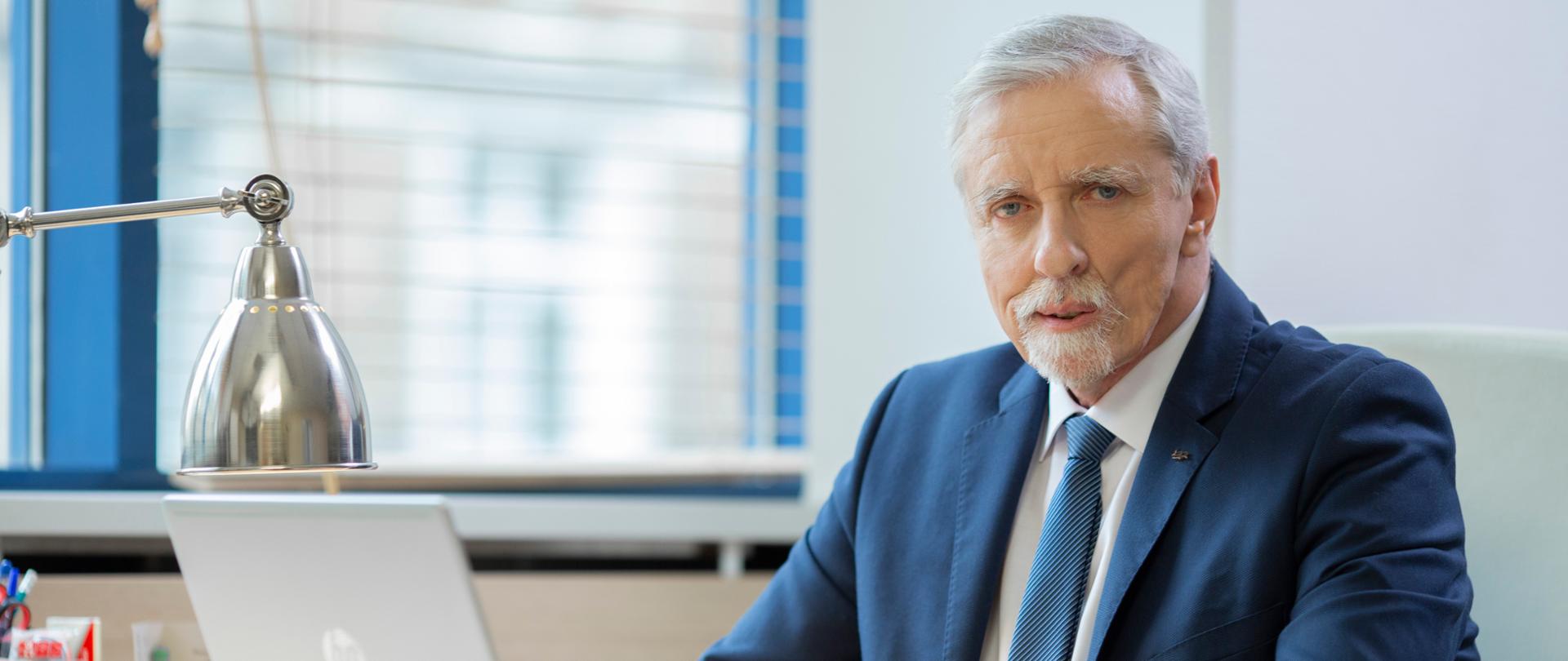 The smartly dressed man on a blurred background
