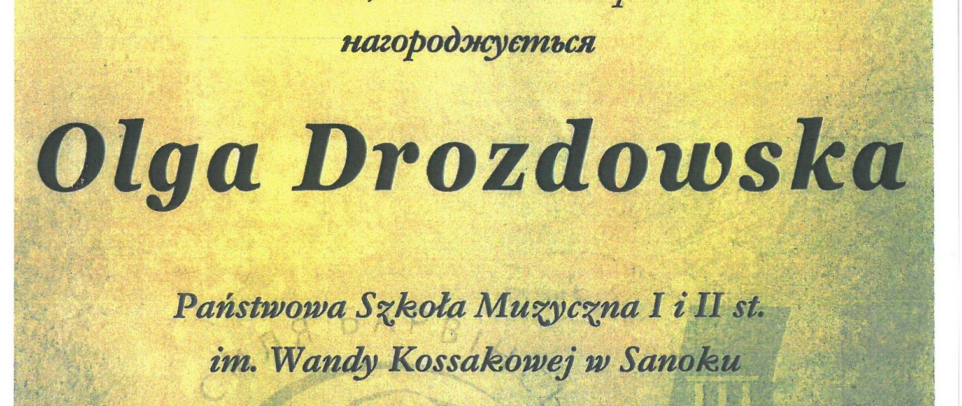 Dyplom - Olga Drozdowska - Tarnopol 19-21.04.2024r. Żółte tło, czarne litery, w górnym rogu logo konkursu 