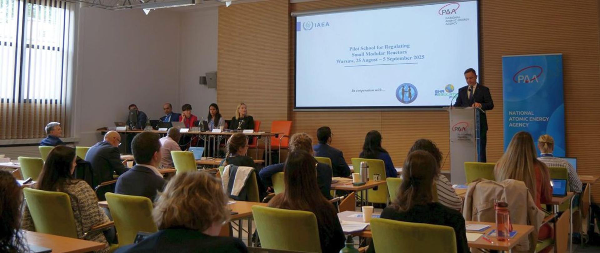 In the background, Andrzej Głowacki, President of PAA, speaks at the opening.