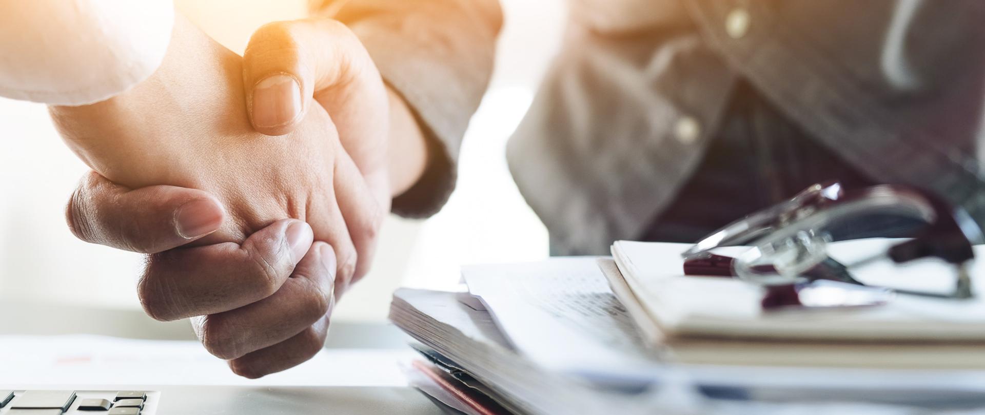 Close up of Business people shaking hands, finishing up meeting, business etiquette, congratulation, merger and acquisition concept