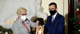 Premier odbiera Betlejemskie Światełko Pokoju.
