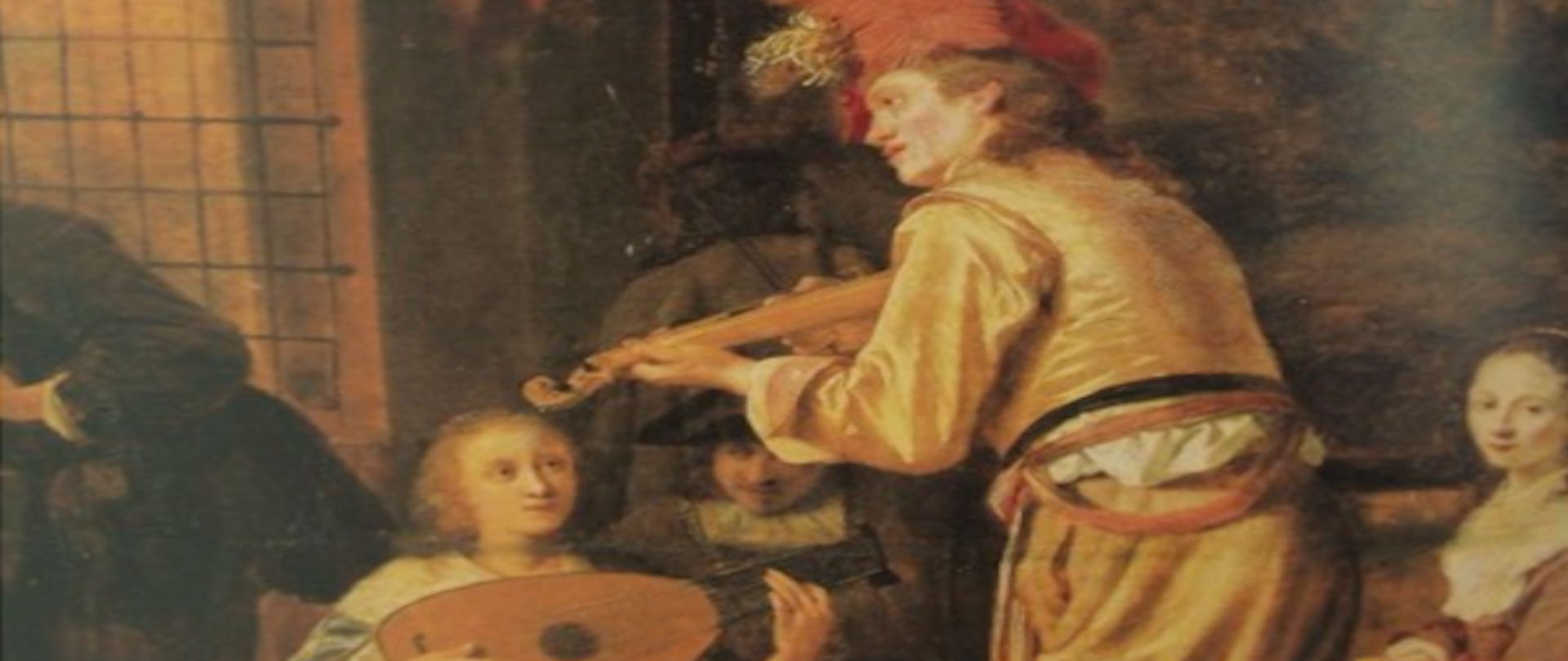 Grafika przedstawia fragment plakatu z grającymi muzykami w dawnych strojach, na tle obrazka biały tekst barok i miniatura