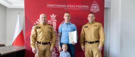 W dniu 26 kwietnia 2024 roku Pan Maciej w towarzystwie swojego syna Michała odebrał z rąk p.o. Zastępcy Opolskiego Komendanta Wojewódzkiego PSP bryg. mgr inż. Grzegorza Brzozowskiego zaświadczenie ukończenia kursu, złożenia egzaminu i uzyskania tytułu Ratownika KPP. W tle znajduje się czerwony banner z białym napisem Państwowa Straż Pożarna Komenda Wojewódzka PSP w Opolu. Wraz z Komendantem i Panem Maciej oraz jego synem na tle banneru stoi ponadto bryg. Wiesław Eliasz Naczelnik Ośrodka Szkolenia KW PSP w Opolu.