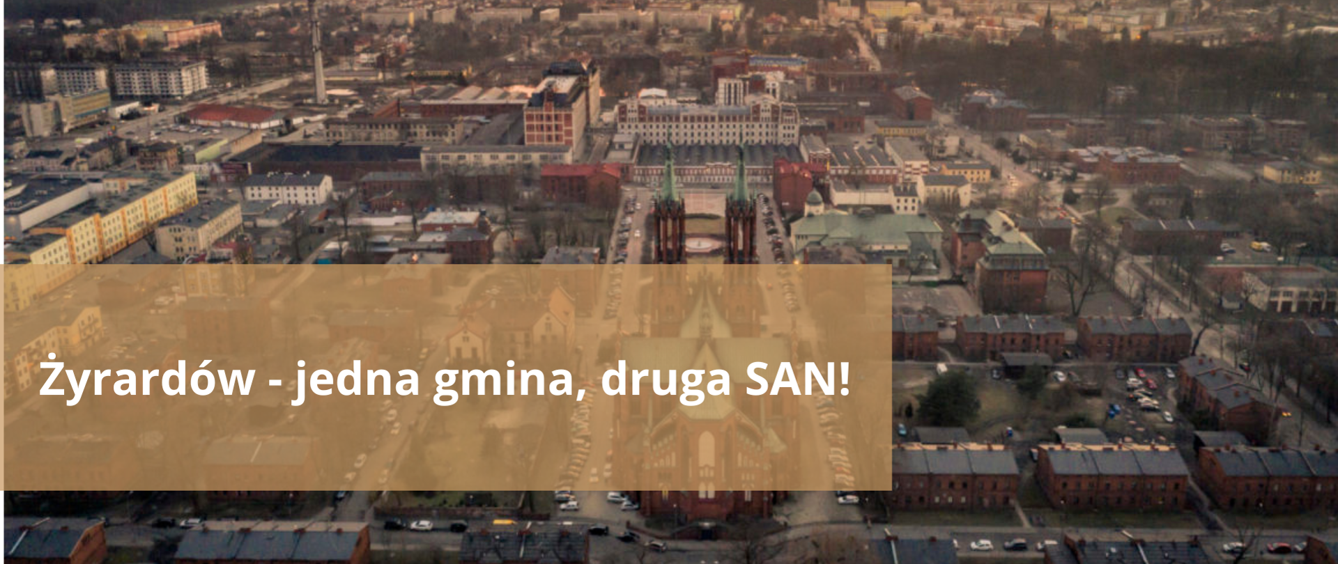 Panorama Żyrardowa. Napis: Żyrardów - jedna gmina, druga SAN