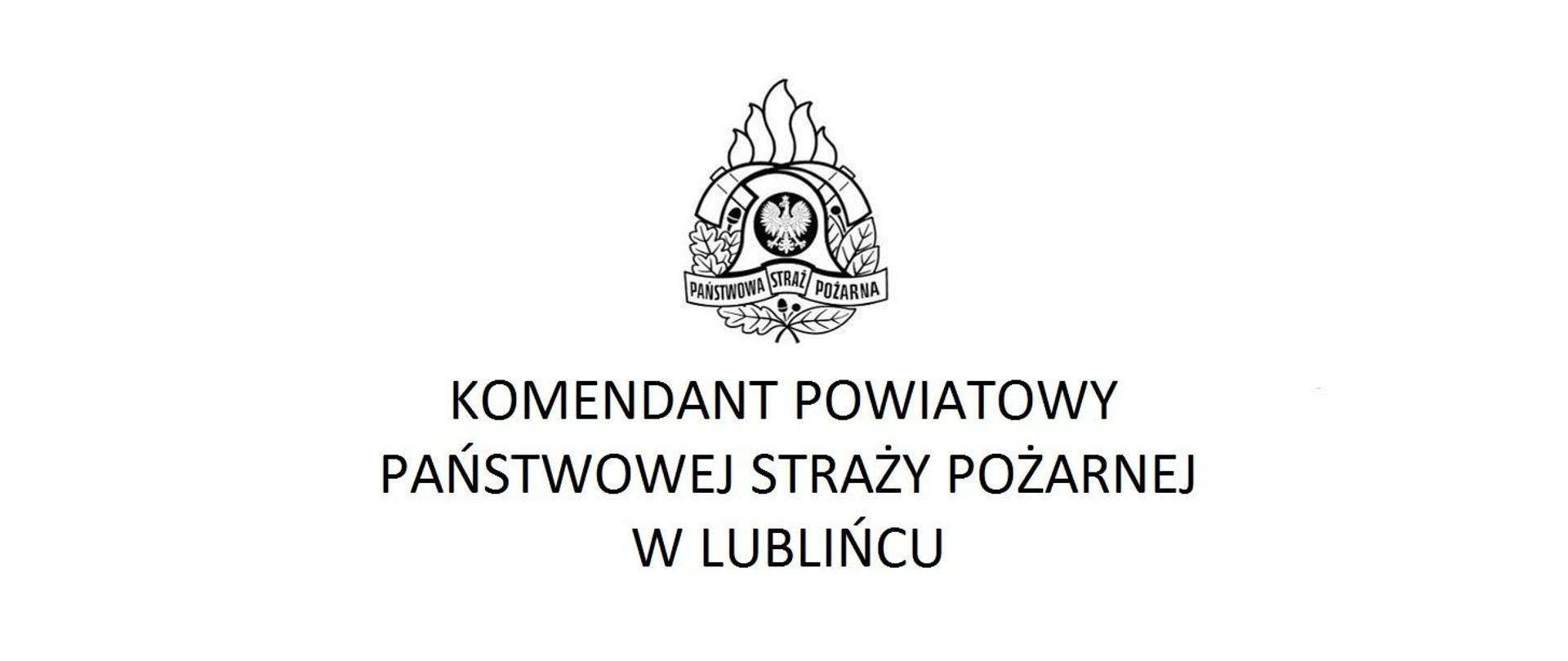W centralnym miejscu logo Państwowej Straży Pożarnej, pod nim napis Komendant Powiatowy Państwowej Straży Pożarnej w Lublińcu.