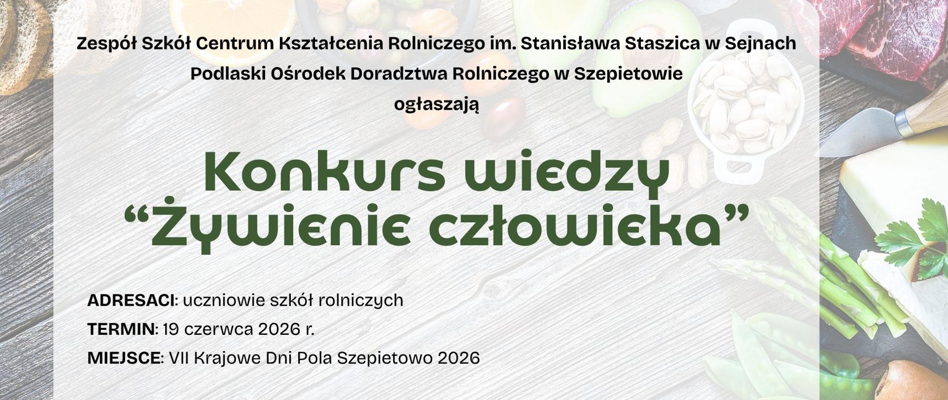 Informacja o konkursie na tle różnych grup produktów żywnościowych leżących na drewnianym stole