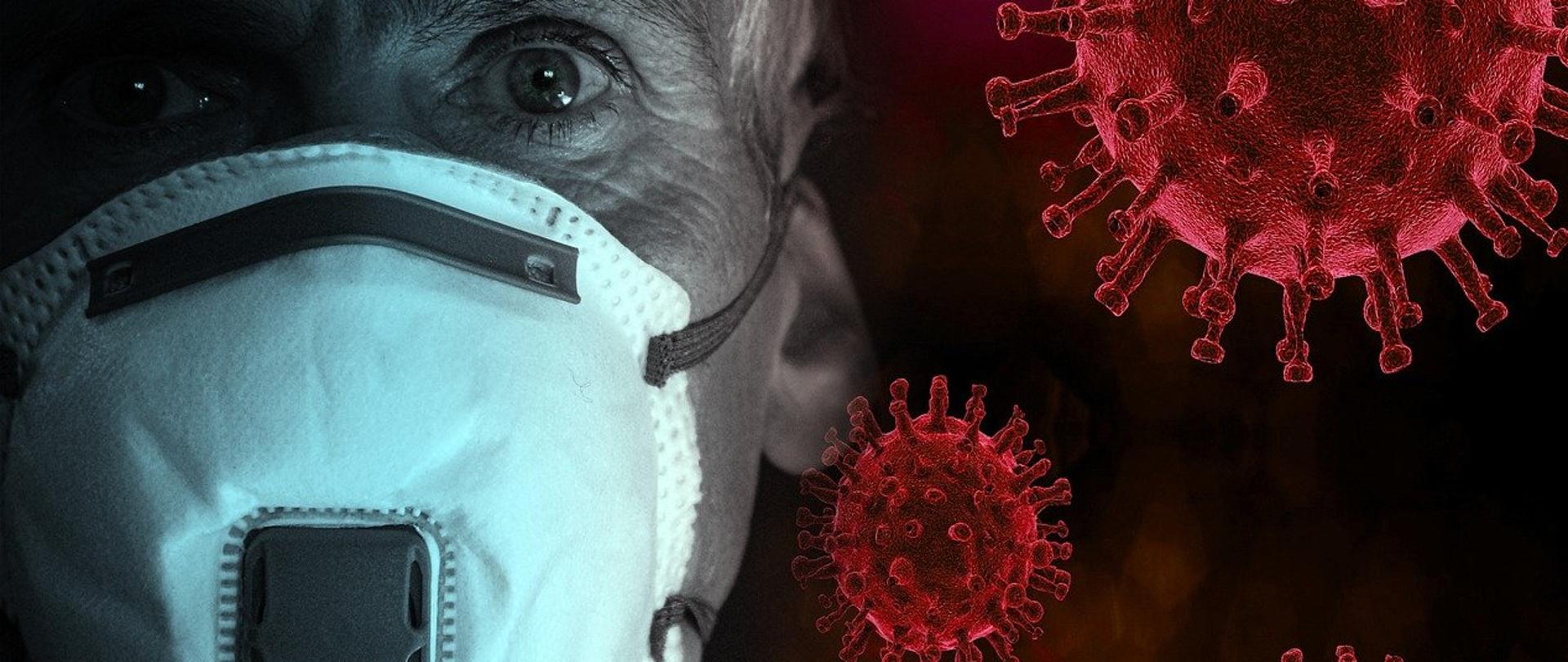 Zdjęcie przedstawia mężczyznę w maseczce ochronnej założonej na twarzy. Na prawo od niego w powietrzu unoszą się trzy koronawirusy w kolorze czerwonym. 
