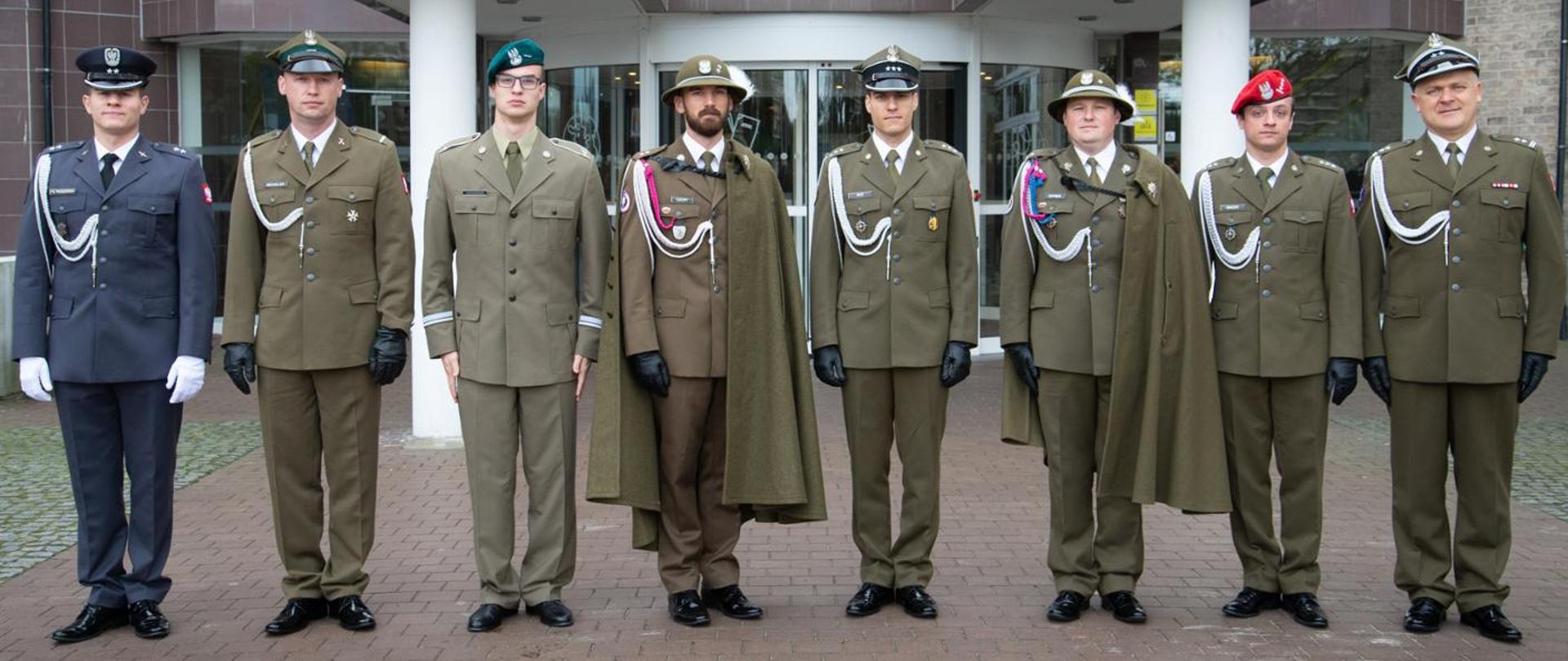 Polish officers standing in front of the building