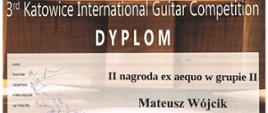 Dyplom - brązowe tło z tekstem II nagroda ex aequo w Grupie II Mateusz Wójcik