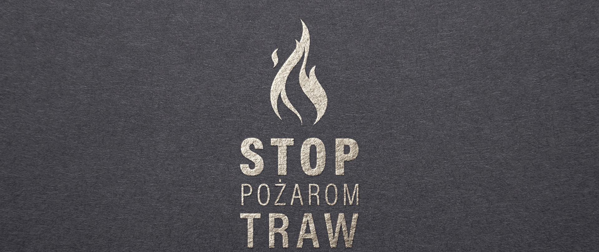 Na ciemnoszarym tle jasnoszary napis "STOP POŻAROM TRAW" powyżej napisu kontur płomienia.
