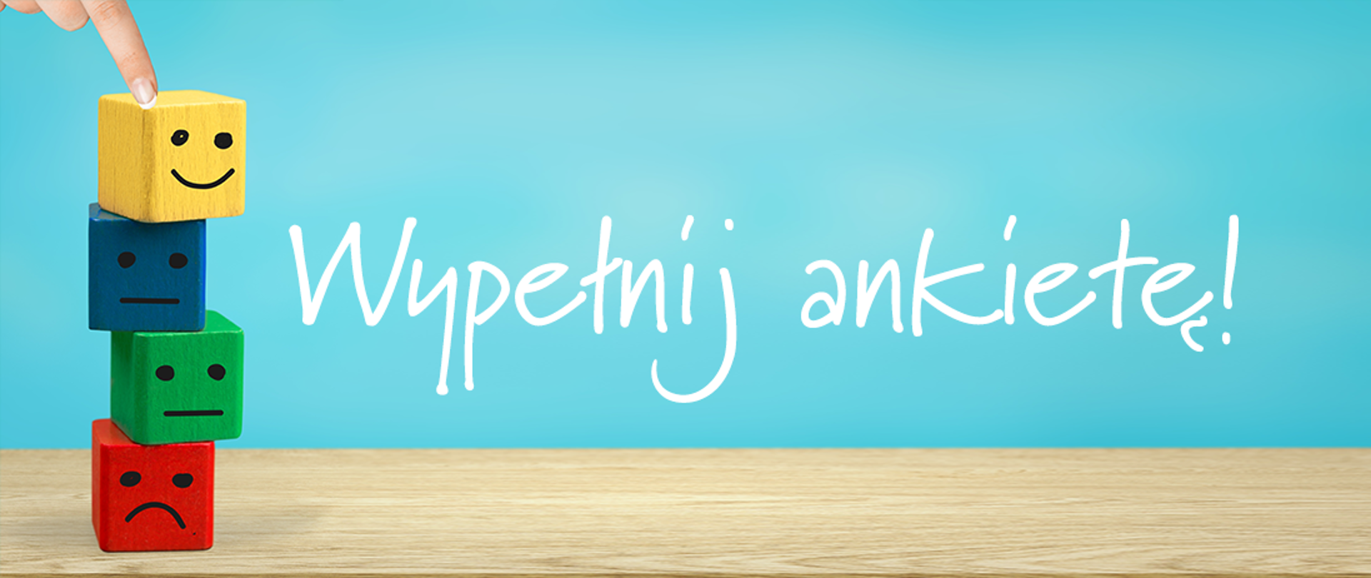 Grafika o treści: "Wypełnij ankietę!" przedstawiający klocki z wizerunkami oddającymi nastroje - smutny, umiarkowany, zadowolony