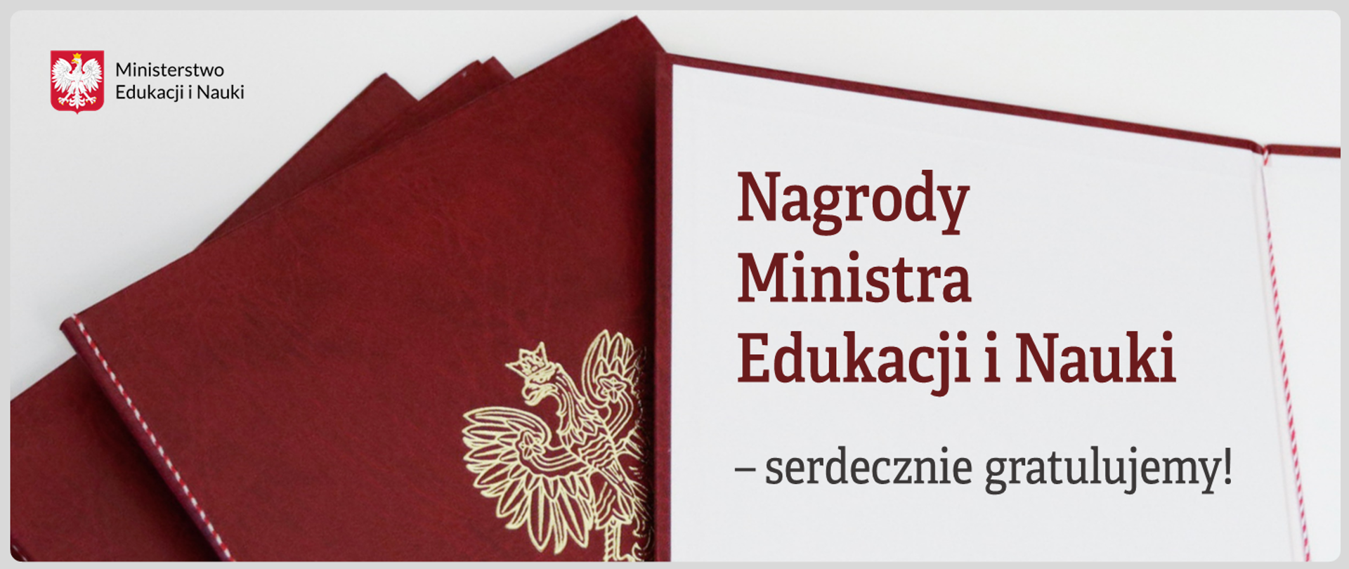 Teczki ministerialne i napis: "Nagrody Ministra Edukacji i Nauki - serdecznie gratulujemy!"