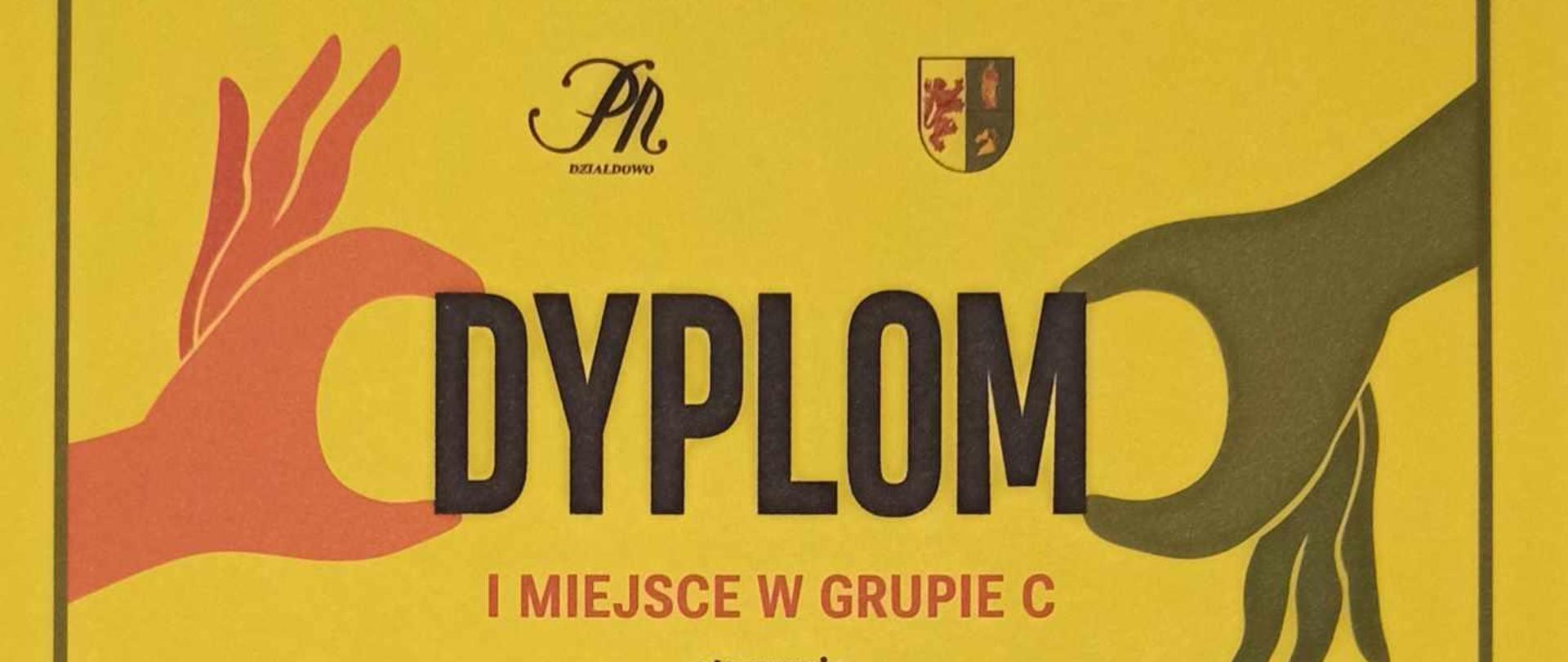 Na żółtym tle dyplom za zajęcie I miejsca