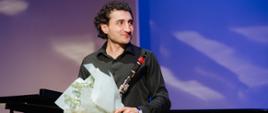 Clarniettist Avetik Ghazaryan with a bunch of flowers