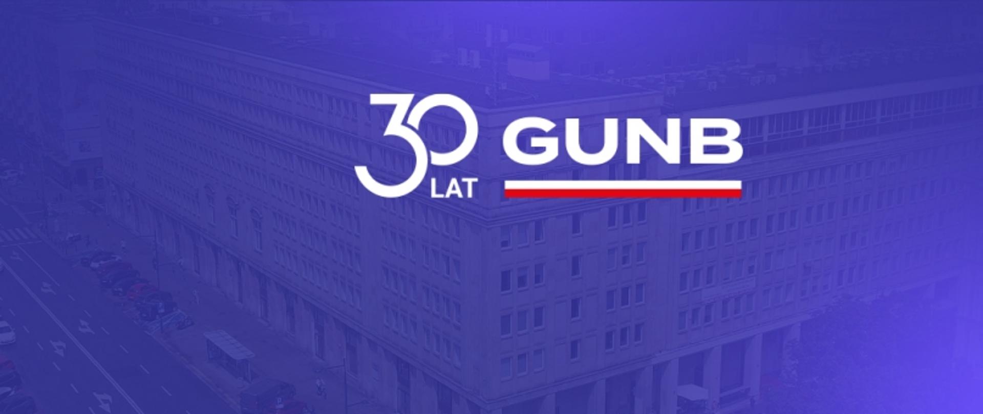 Na granatowej grafice logo 30-lat GUNB. W tle zdjęcie urzędu 