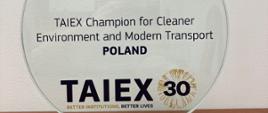 Okrągła nagroda z napisem Taiex