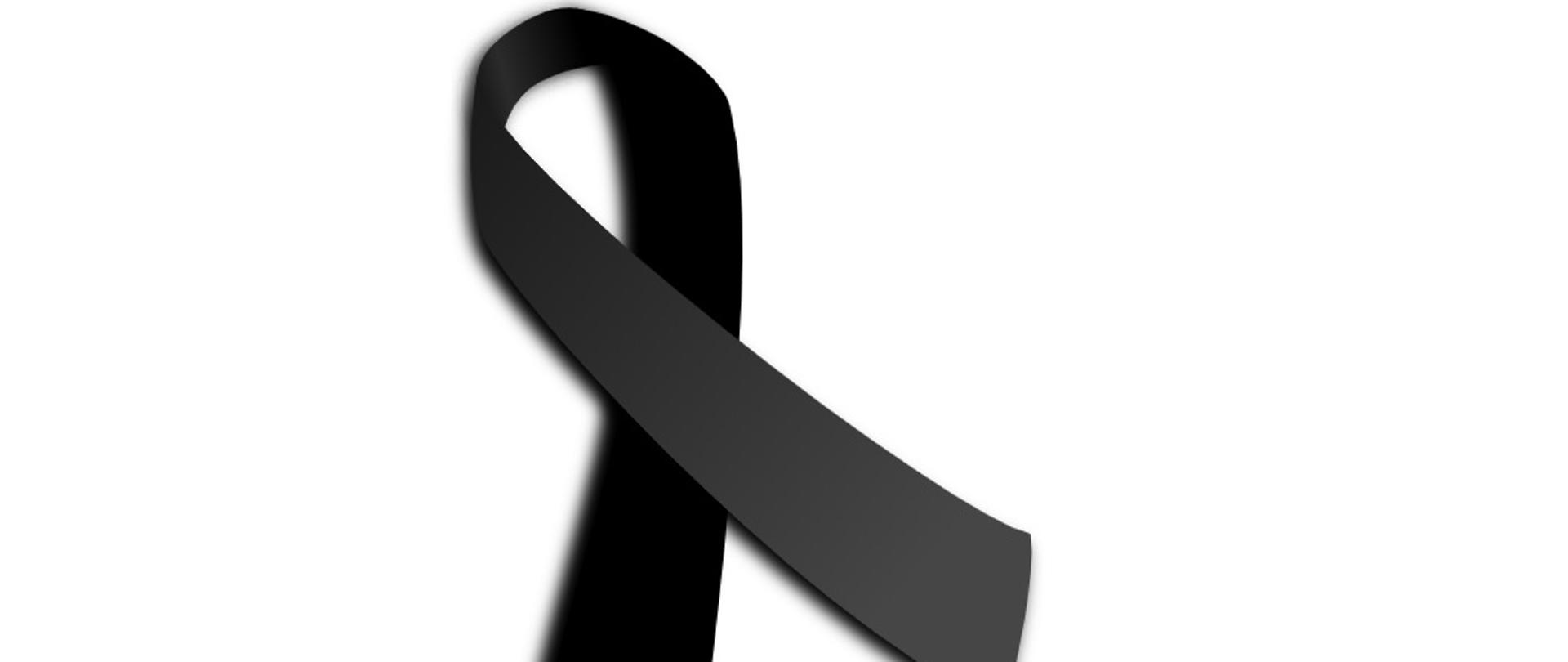 Zdjęcie przedstawia kir żałobny, tzn. czarną wstążkę upamiętniającą osobę zmarłą.