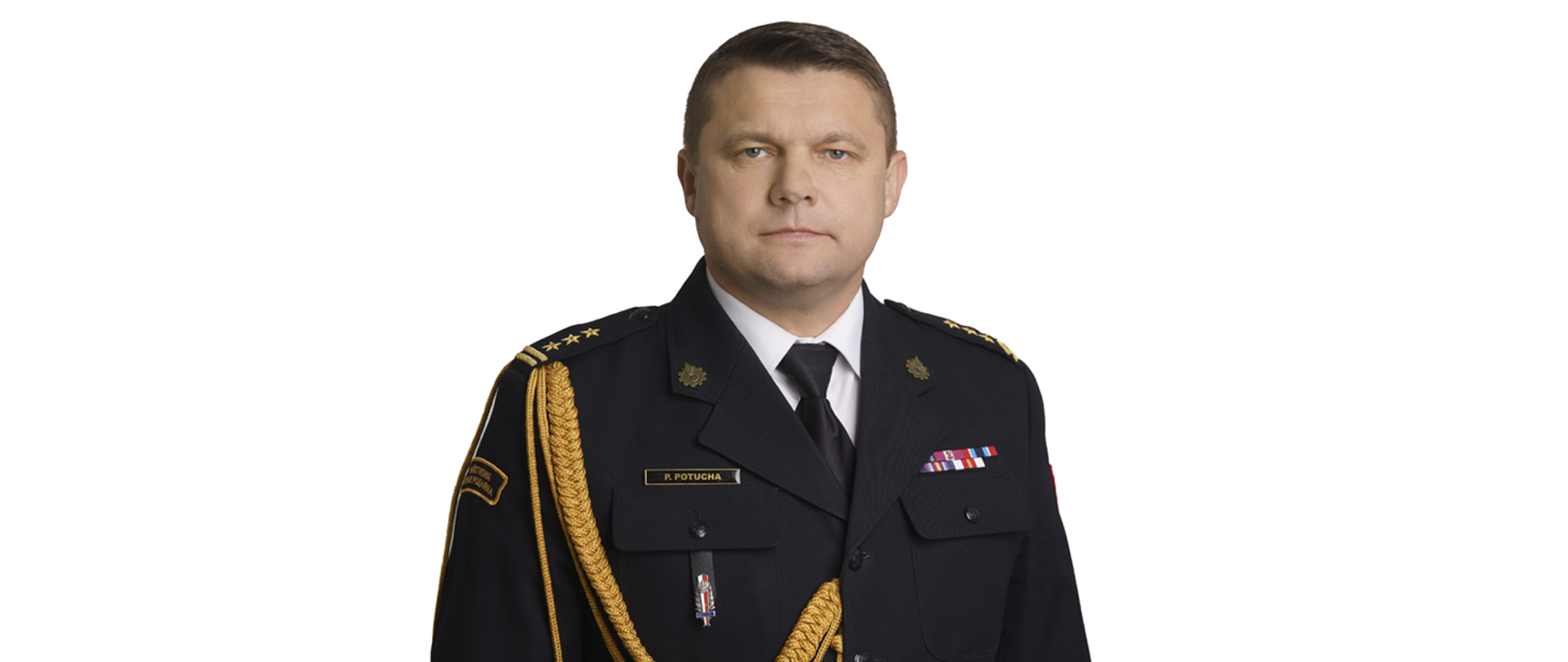 Zdjęcie przedstawia Pawła Potuchę, Komendanta Powiatowego Państwowej Straży Pożarnej w Zwoleniu. Jest to portret mężczyzny w mundurze galowym strażaka, z widocznymi dystynkcjami na pagonach. Na piersi munduru widoczne są baretki odznaczeń.

