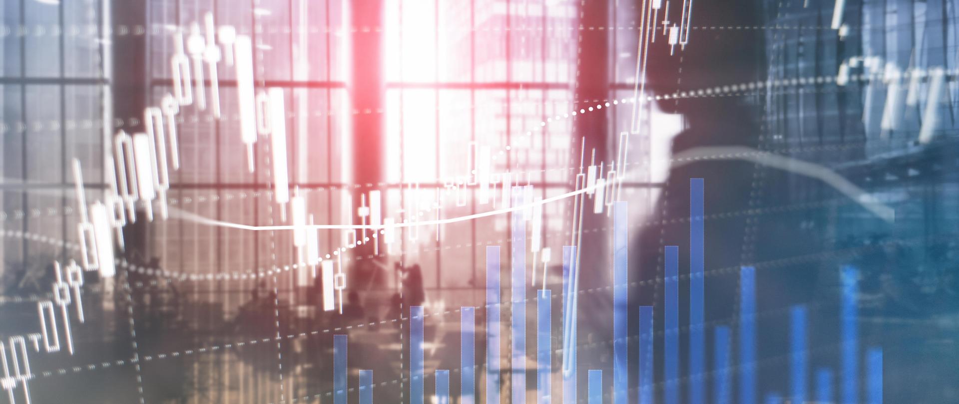 Rozmyte wykresy na tle okien wierzowca