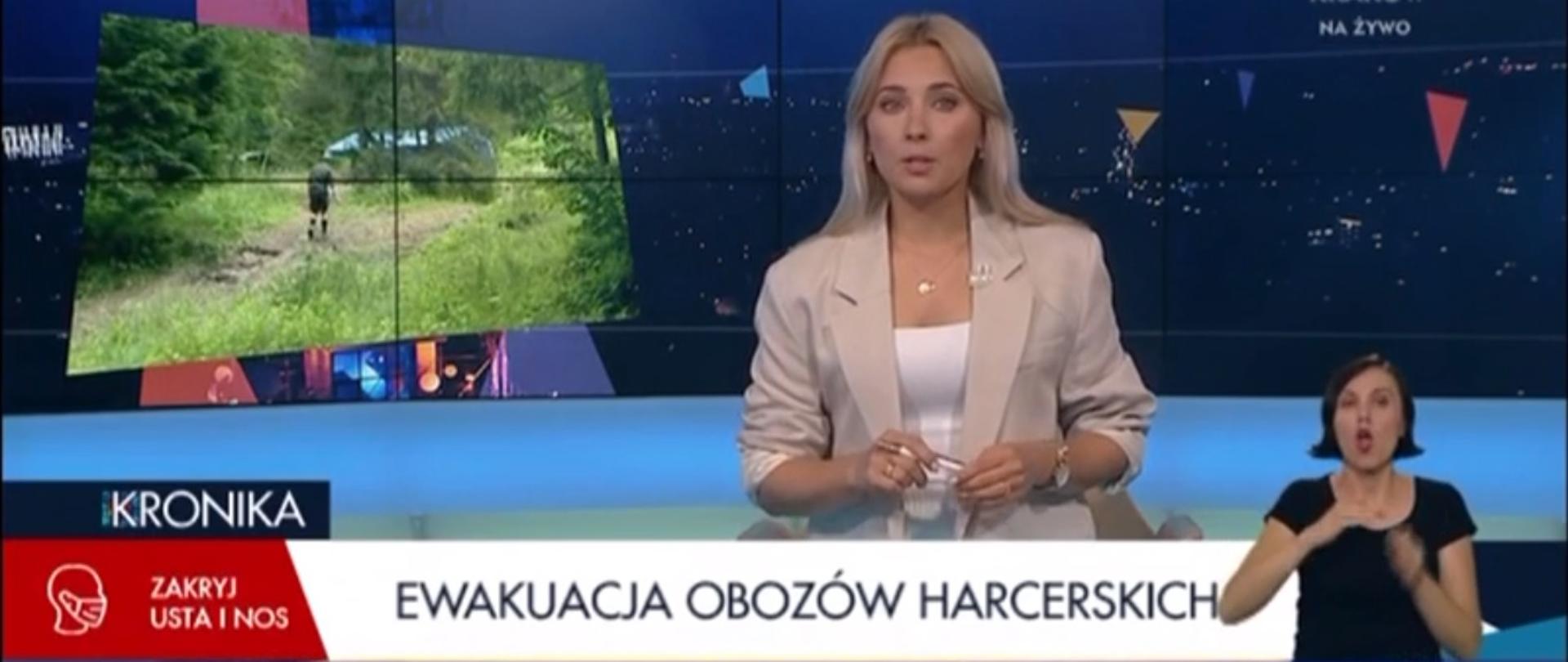 Prezenterka w TVP 3 Kraków zapowiada materiał o obozach harcerskich.