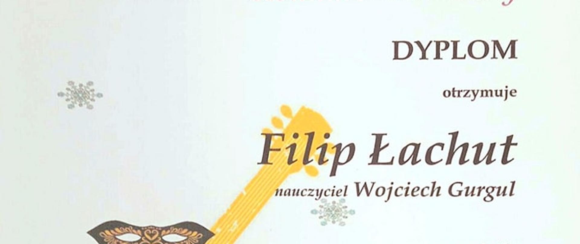 dyplom Filipa Łachuta uczeń klasy gitary, który otrzymał III nagrodę na XX Karnawałowym Konkursie Gitarowym w Skarżysku -Kamiennej, grafika na dyplomie przedstawia pomarańczową gitarę na bladym tle z brązowymi i czerwonymi napisami oraz logiem szkoły muzycznej w Skarżysku -Kamiennej na górze