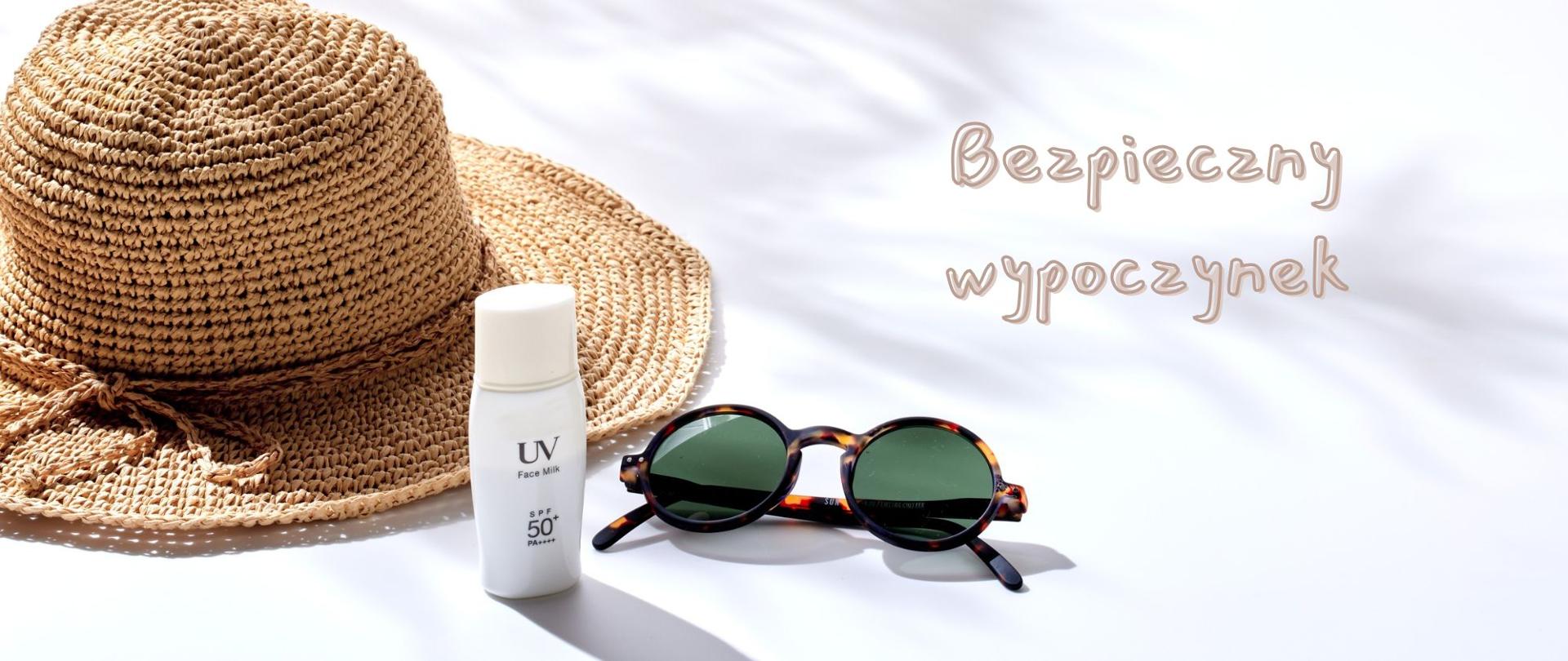 napis bezpieczny wypoczynek a tle poglądowego zdjęcia słomkowego kapelusza okularów UV oraz filtru UV