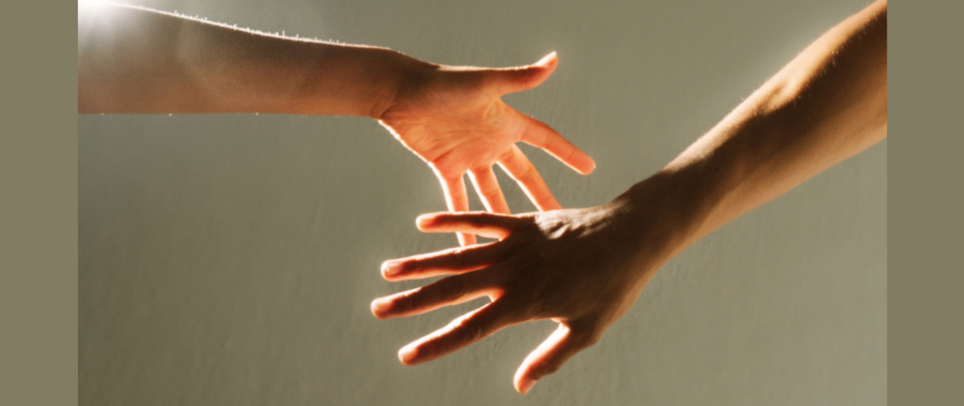 Na grafice dwie łączące się dłonie