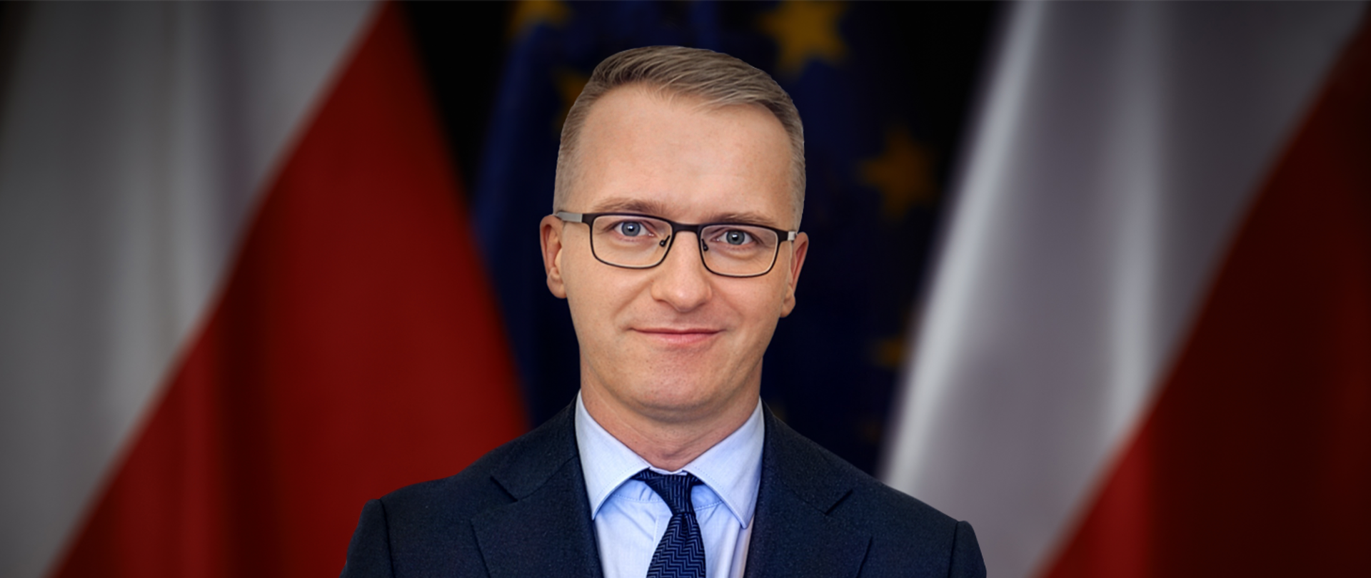Director General Piotr Kudelski against Polish and EU flags