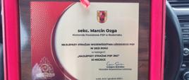Dyplom z napisem sekc. Marcin Ozga Komenda Powiatowa PSP w Radomsku, najlepszy strażak województwa łódzkiego PSP w 2023 roku w kategorii najlepszy strażak psp jrg trzecie miejsce