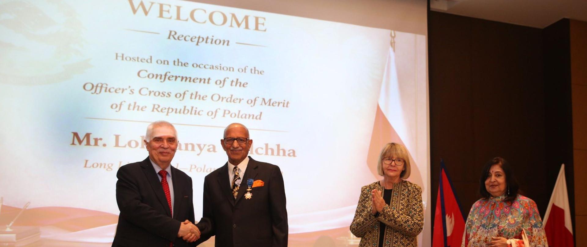 Head of Mission, Piotr Świtalski, shakes hands with the Honorary Consul of the Republic of Poland in Nepal, Mr. Lokmanya Golchha, during the ceremony of conferment of the Officer's Cross of the Order of Merit of the Republic of Poland to the Honorary Consul
