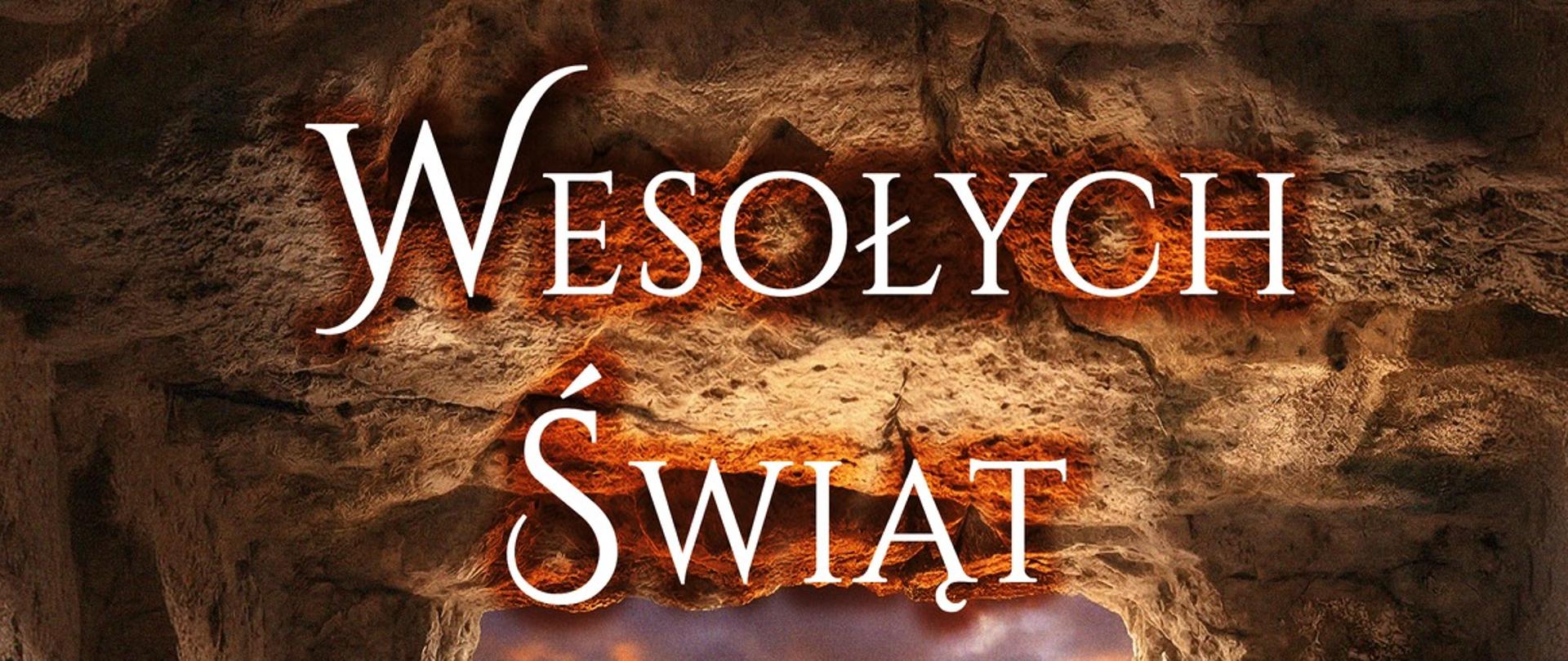 Obraz przedstawia widok na trzy krzyże z groty kamiennej. Widnieje też na nim napis: "Wesołych Świąt Zmartwychwstania Pańskiego życzy Komendant Powiatowy PSP w Ustrzykach Dolnych bryg. Emil Szmyd".