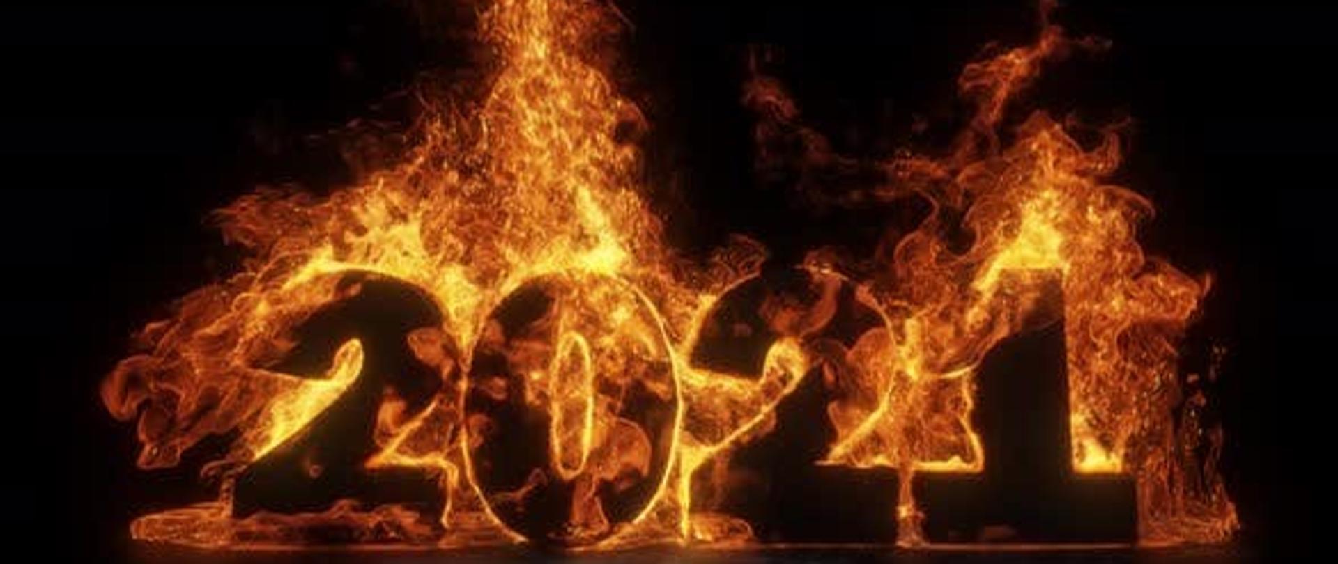 Zdjęcie przedstawia grafikę - liczbę 2021 która płonie. Cyfry na czarnym tle.