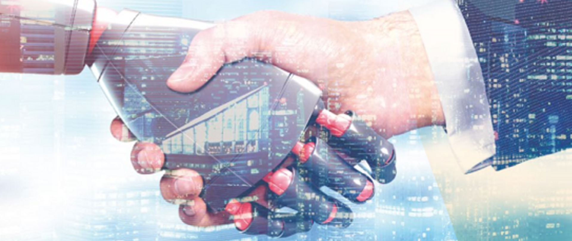 zdjęcie przedstawia uścisk dłoni, z prawej jest normalna ludzka dłoń, natomiast z lewej jest dłoń maszyny-cyborga, wypełniona cyfrowymi danymi