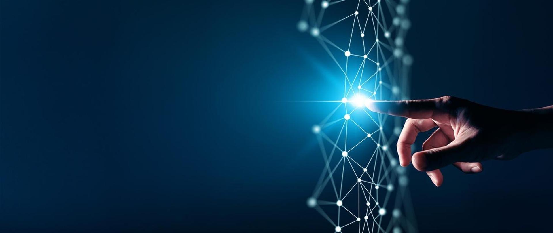 Człowiek dotyka palcem wirtualnego schematu