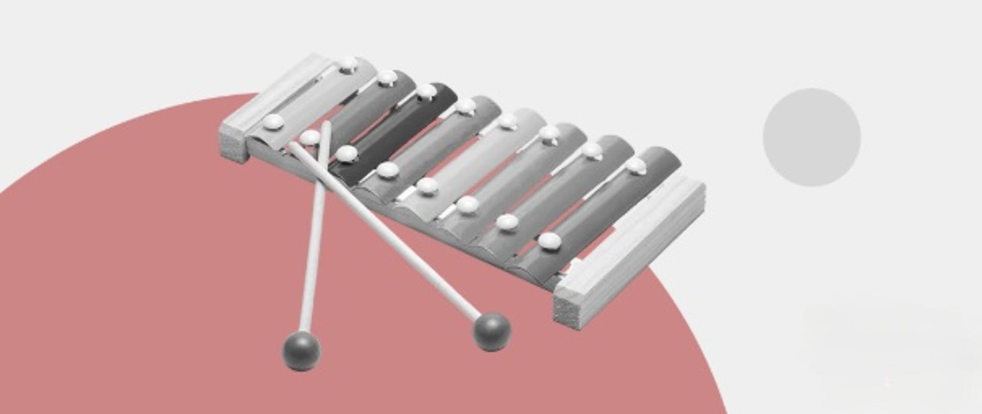 Cymbałki na szaro różowym tle. 