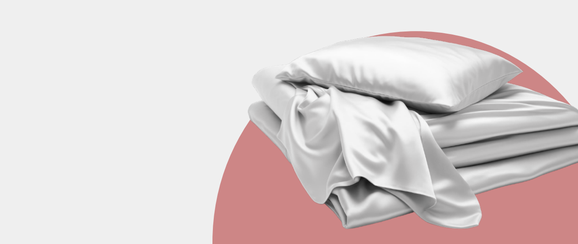 Grafika prezentująca złożoną w kwadrat kołdrę, a niej leży poduszka, a pomiędzy wystaje prześcieradło. Pościel jest w jasnym, popielatym kolorze. Tło jest szaro różowe. 