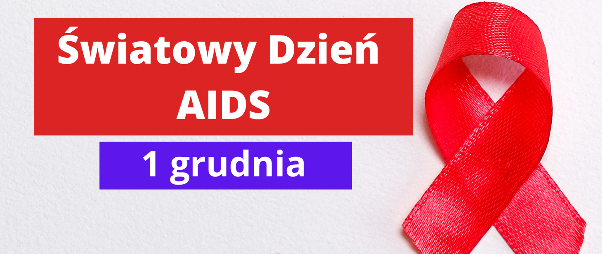 Światowy Dzień AIDS. 1 grudnia. Czerwona wstążka z materiału leżąca na kartce papieru