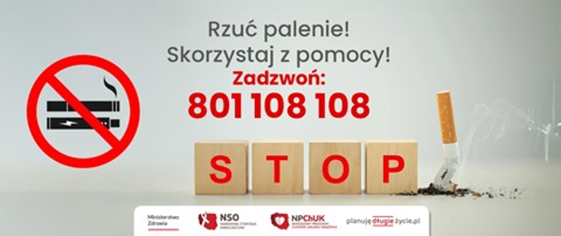 Na zdjęciu umieszczony jest napis: Rzuć palenie! Skorzystaj z pomocy! Zadzwoń: 801 108 108. Pod numerem telefonu znajduje się ułożony z drewnianych klocków czerwony napis STOP, obok którego po prawej stronie jest zgnieciony papieros, a po lewej widoczny jest znak zakazu z umieszczonymi w środku papierosami elektronicznymi.