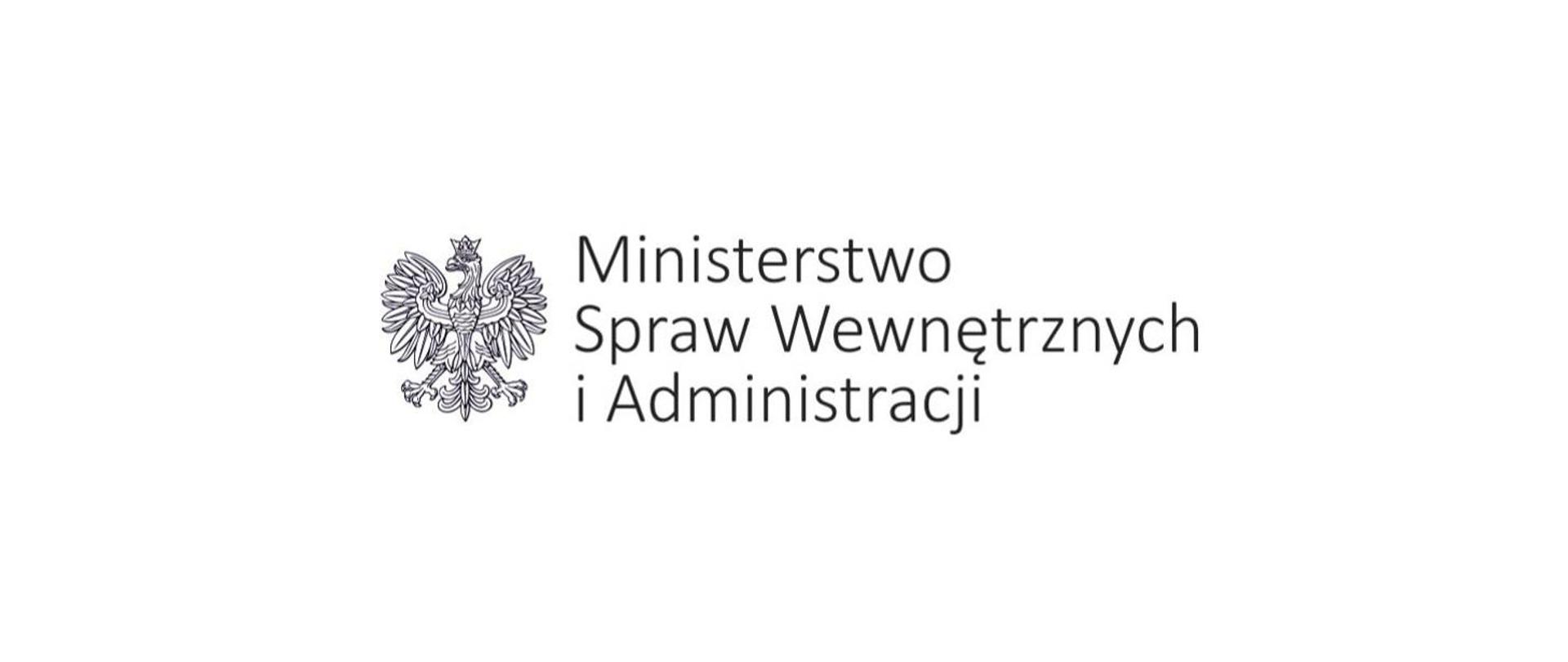 Biało-czarne zdjęcie przedstawia orła w koronie i napis ministerstwo spraw wewnętrznych i administracji