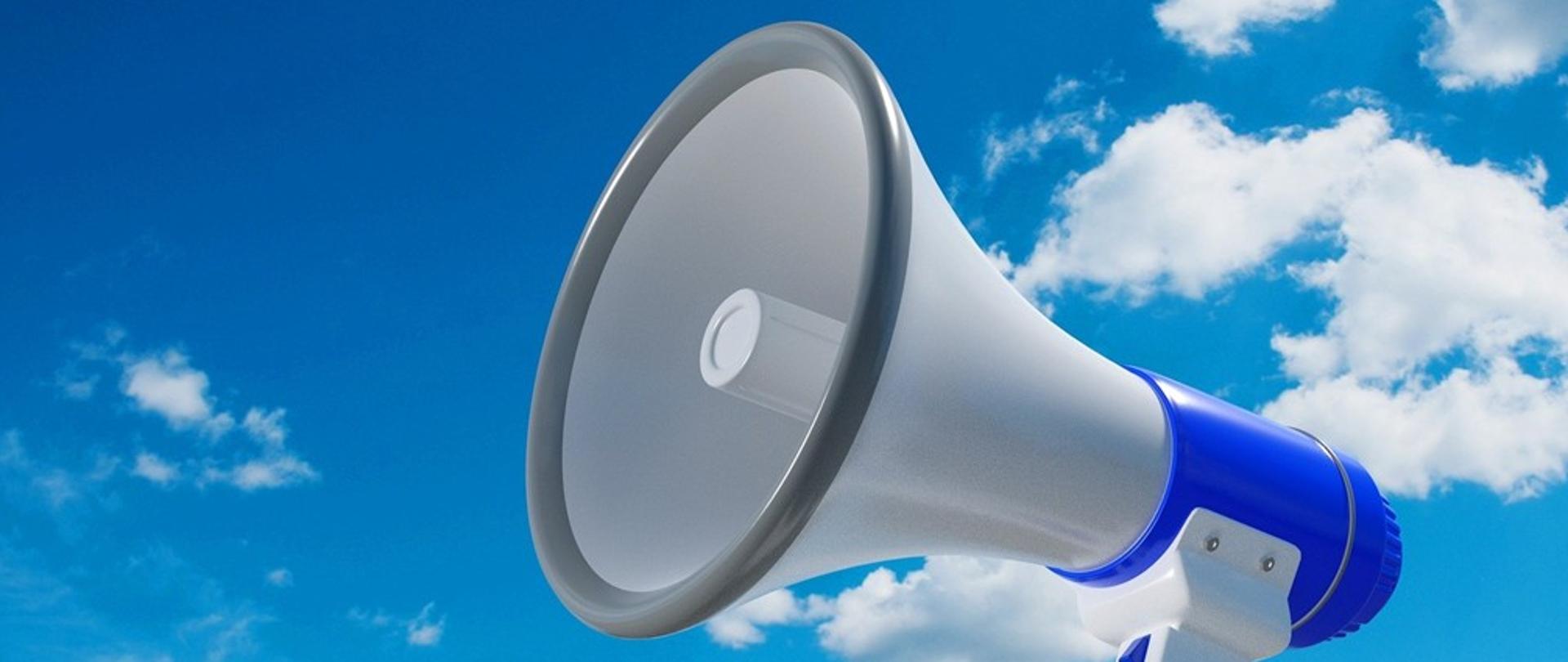 na tle nieba grafika przedstawiająca głośnik alarmujący 