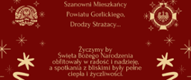 Na zdjęciu widoczne dwa loga Państwowej Straży Pożarnej i Ochotniczych Straży Pożarnych na bordowym tle i życzenia świąteczno-noworoczne dla mieszkańców powiatu i strażaków.